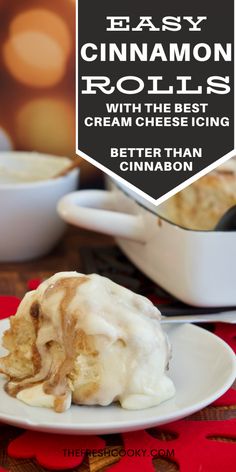 an easy cinnamon roll with the best cream cheese icing is on a white plate