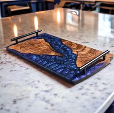 a wooden tray sitting on top of a counter