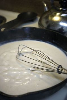 a pan filled with batter sitting on top of a stove