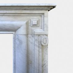 an old white marble arch with a door on the top and bottom, in front of a light gray background