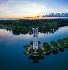 An aerial view of the bell tower at Furman University, with the sun setting in the background Architectural References, Lake Bell, Walking Path, Bell Tower, Walking Paths, Dji Mavic Pro, Mavic Pro, Space Needle