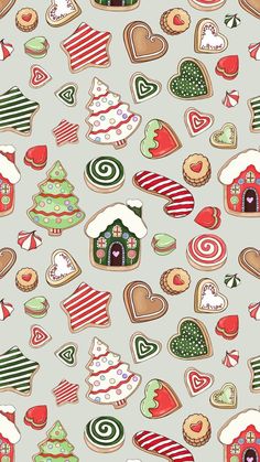 an assortment of christmas cookies on a gray background with red, white and green designs