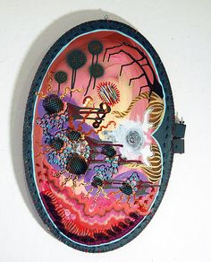 a colorful plate is hanging on the wall