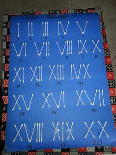 a blue mat with white numbers and roman numerals on it