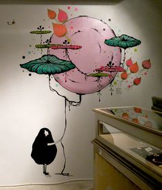 a painting on the wall of a room with dragonflies flying over it and a person holding an umbrella