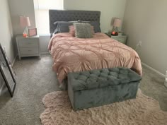 a bedroom with a bed, dresser and mirror