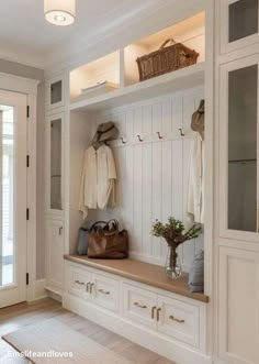 a large white coat rack in the corner of a room with lots of closet space