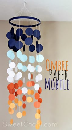 a mobile made out of paper circles with the words ombre pare mobile above it