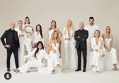 the real housewives cast is posing for a group photo in their white outfits and tuxedos