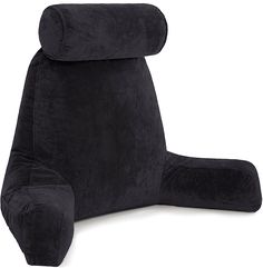 a black reclining chair that is made out of plush material and has a pillow on the back