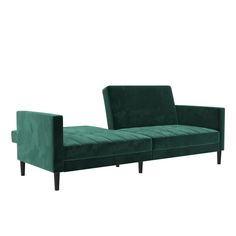 a green couch sitting on top of a white floor