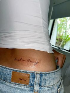 a woman's stomach with a tattoo on the side that says, love you