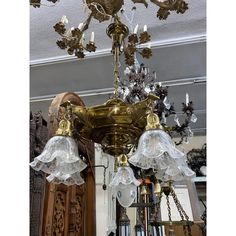 an ornate chandelier hangs from the ceiling