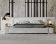 a modern bedroom with white and gray decor