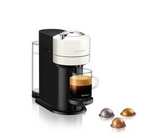 an espresso machine with three different types of coffee in front of it on a white background