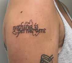 a woman with a tattoo on her arm that reads, nothing is permanent pigmentment