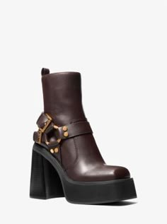 A moto boot with retro flair: our Crosby leather boot combines classic harness detailing with a soaring platform and heel reminiscent of ’70s style. Complete with a side-zip closure and square toe, it’s sure to be the standout of your cool-weather wardrobe. Fancy Boots For Women, 70s Style Boots, 70s Boots, Grunge Boots, Brown Heeled Boots, Michael Kors Boots, Shoes Too Big, Stunning Shoes, Shoe Inspo