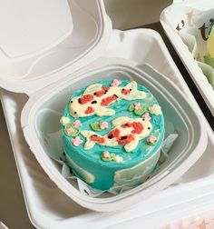 a cake in a plastic container on a table