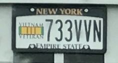 a new york license plate is shown in black and white, with the number 733wnn on it