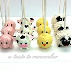 a group of cake pops with animals on them and candles in the shape of sheeps