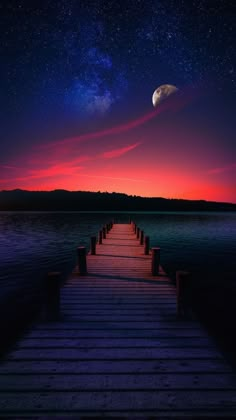 a wooden dock at night with the moon in the sky