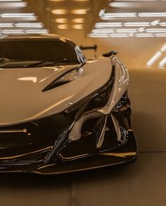 a black and white sports car parked in a garage