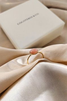 Brilliantly elegant, the delicate Eurydice gold ring in pink stone can be worn every day and enhances all hands. Elegant handcrafted ring in 16k gold plated. Ideal as a gift! It is topped with a sublime pink feldspar moonstone which promotes love, tenderness and gentleness. It soothes the heart and stimulates creative intelligence and intuition. ♥ 24K gold plated and Feldspar Moonstone (pink) or Blue Apatite. ♥ Adjustable size. ♥ Durable & water resistant. ♥ Ready to give (gift bag included). IN Rose Gold Plated Open Crystal Ring, Adjustable Rose Gold Plated Rings, Adjustable Gold Plated Midi Rings As Gift, Gold Opal Ring Gift, Pink Rings With Natural Stones For Gift, Gold Plated Crystal Gemstone Ring As A Gift, Yellow Gold Pink Opal Jewelry For Gift, Adjustable Rose Quartz Rose Gold Ring, Rose Gold Plated Rings As Gift