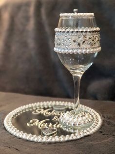 a wine glass sitting on top of a wooden table