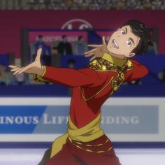 a man in red and gold outfit skating on ice with his arms out to the side