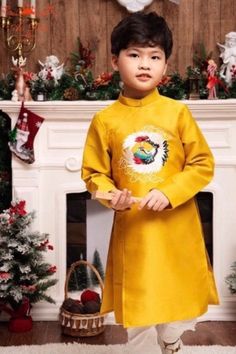 Pre-Made Boy Vietnamese Ao Dai (áo dài bé trai), Kids Vietnamese traditional dress, cheongsam, qipao Color: Gold Ao Dai does not include pants Kid's Size Measurements SizeWeight (kg/lb) length (cm) width (cm) 110-12/22-26.5 46 60 212-14/26.5-30.9 48 63 314-16/30.9-35.3 50 65 416-18/35.3-39.7 52 68 518-20/39.7-44.1 54 70 620-22/44.1-48.5 56 73 722-24/48.5-52.9 58 75 824-27/52.9-59.5 60 78 927-30/59.5-66.1 62 80 1030-35/66.1-77.2 64 83 1235-39/77.2-86 68 87 1439-43/86-94.8 72 92 1643-46/94.8-101.4 Traditional Festive Cheongsam For Ceremonial Occasions, Traditional Festive Ao Dai With Stand Collar, Fitted Cheongsam For Festivals, Traditional Festive Ceremonial Cheongsam, Traditional Embroidered Festive Cheongsam, Traditional Yellow Ao Dai With Long Sleeves, Traditional Floor-length Ao Dai For Evening, Traditional Yellow Ao Dai, Yellow Fitted Traditional Ao Dai