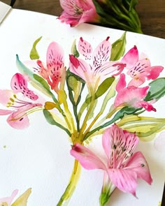 watercolor painting of pink flowers on white paper