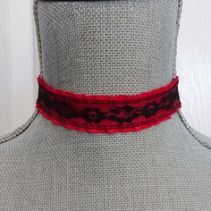 Red choker necklace is made up in a ruffled red fabric ribbon with a black lace overlay. The ribbon is crimped on the ends with black metal crimp bars and the choker measures 13" on the first link closure and with an extension chain allows for adjustable fit to 14 1/2 ". The extension chain is a matching black chain with a wire wrapped and linked black glass bead dangle on the end of the chain.  There is a black metal lobster claw closure on the choker. If you need another size just send me a message with your order and I can adjust the length for you. All of my jewelry items come boxed and ribbon tied and tagged for easy gifting. Red Lace Choker, Red Punk Choker As Gift, Red Choker For Halloween Party, Red Emo Jewelry For Party, Red Punk Choker For Festivals, Red Emo Choker Jewelry, Red Emo Style Choker Jewelry, Red Gothic Choker For Festivals, West Girl