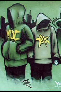 two people standing in front of a graffiti wall with the words nyc written on it