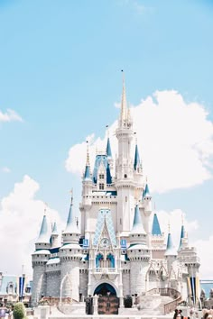 people are standing in front of a castle