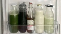 there are many different types of drinks in the refrigerator together, including milk and soda