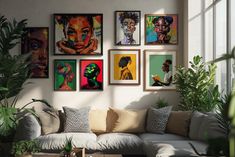 a living room filled with lots of art on the wall above a white couch covered in pillows