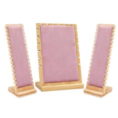 two wooden frames with pink velvet coverings are shown on the same stand as each other