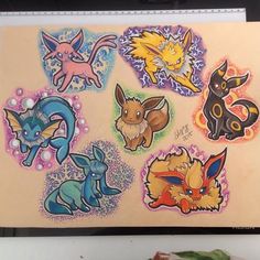 a bunch of pokemon stickers on a wall next to a vase with some flowers in it