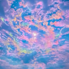 the sky is filled with colorful clouds and bright colors