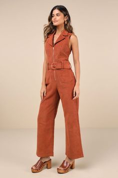 Let everyone know you're a confident cutie with the Lulus Energetic Appeal Rust Orange Corduroy Sleeveless Belted Jumpsuit! Classic corduroy fabric shapes a sleeveless bodice with a collared neckline, notched lapels, and flattering princess seams. Belt loops and a wide statement belt (with a covered buckle) accent the waist, atop wide legs with functional front and back patch pockets. Full-length hems. Exposed gold zipper at the front. Fit: This garment fits true to size. Length: Ankle length. S Trendy Sleeveless Jumpsuits And Rompers For Fall, Sleeveless Brown Jumpsuits For Workwear, Rust Jumpsuit, Corduroy Jumpsuit, Wineries Outfit, Jumpsuit With Belt, Orange Jumpsuit, Statement Belt, Belted Jumpsuit