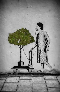 a drawing of a woman pushing a wheelbarrow with a tree on it