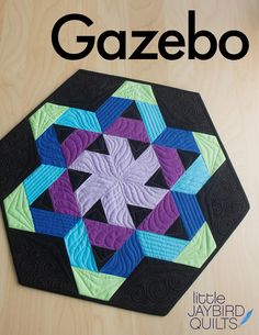 a book with the title gazebo written in black and purple, on top of a