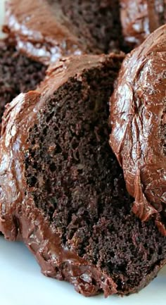 chocolate cake with frosting on a white plate