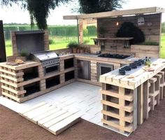 an outdoor kitchen made out of wooden pallets