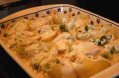 a casserole dish with chicken and broccoli