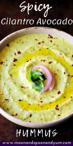 hummus in a bowl with the title spicy cilantro avocado