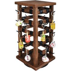 a wooden display case with key chains hanging from it's sides