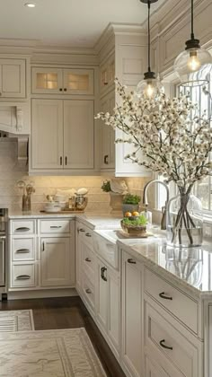 a large kitchen with white cabinets and marble counter tops, along with an area rug on the floor