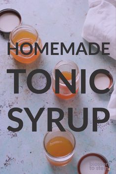 homemade tonic syrup in small glasses on a table with the words, homemade tonic syrup