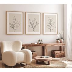 a living room with three framed pictures on the wall